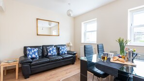 Open plan living space with dining area
