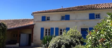 The front aspect of the house inside the walled garden