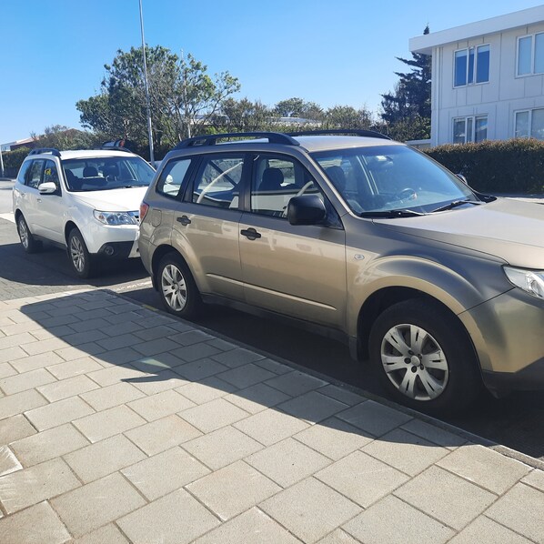 either one of these cars come free with the apartment.