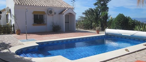 View of the pool area, and one side of the house.