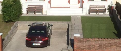 Front of house with 2 car off road parking.