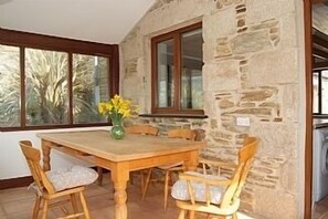 Conservatory-style dining room at the front of the property.