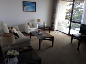 Main lounge side view leading to main balcony with sea views. 