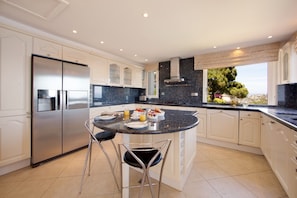 Large kitchen with sea views