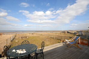 Enjoy the panoramic sea views from the decking