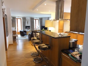 Kitchen / bar area as one enters the apartment