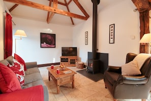 The spacious lounge has a vaulted ceiling