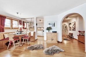 Living room with dining area and kitchen beyond