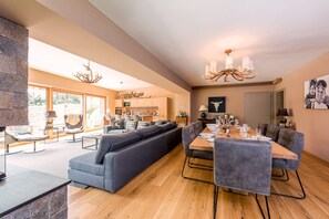 Open plan Kitchen/Living Room/Dining Room with fireplace and views of the slopes
