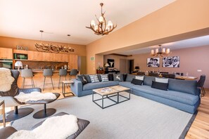 Open plan Kitchen/Living Room/Dining Room with fireplace and views of the slopes