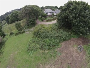 Aerial view of house showing surrounding National Trust land