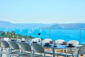 Outdoor dining area with sea view, a perfect spot for al-fresco dining!