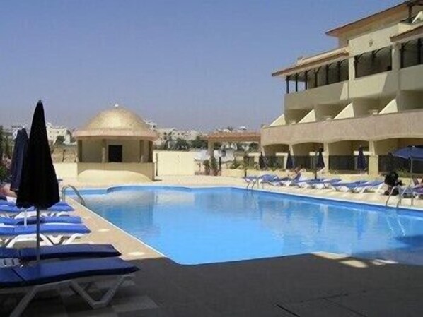 The Olympic sized stepped pool with loungers