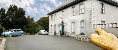 View of house as approached from elegant driveway