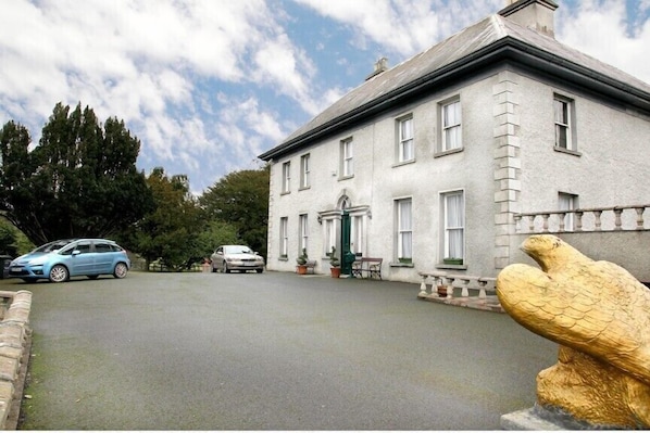 View of house as approached from elegant driveway
