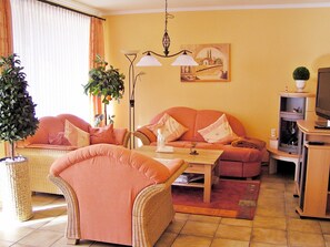 Cosy living room with seats & fireplace oven