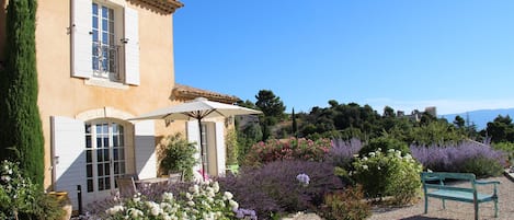 Les Agapanthes and the view over the Marquis de Sade's castle