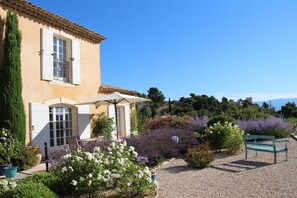 Les Agapanthes and the view over the Marquis de Sade's castle
