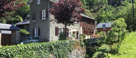 The house sits next to a waterfall and rushing stream. It gets full sun all day.