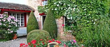 Terrasse-Jardin vue sur maison