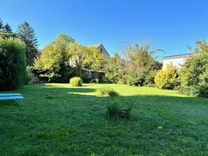 Large garden surrounded by stone walls