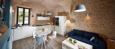 Living room with stone and bricks vaults