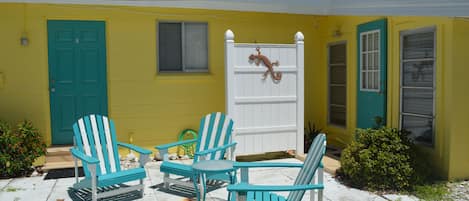 There is an outside shower behind that white wall- perfect for rinsing off sand!