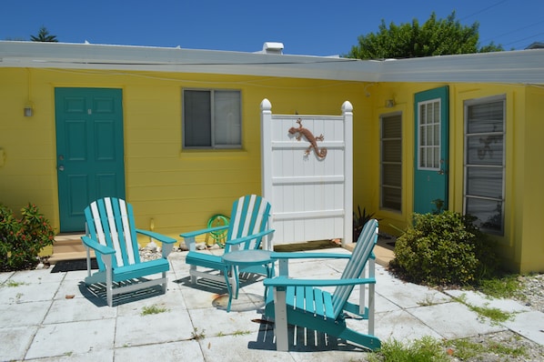 There is an outside shower behind that white wall- perfect for rinsing off sand!