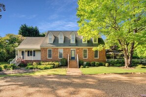 Our stunning front yard with beautiful flowers and manicured lawns is the perfect spot to relax and enjoy the beauty of nature.