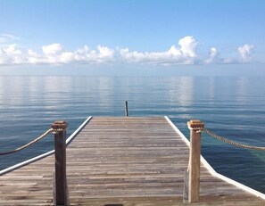 View from the porch. Under the dock you snorkel with many kinds of fish.
