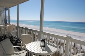 Seating for 8 on the 30 foot by 8 foot deck that sits just 5 feet above the sand