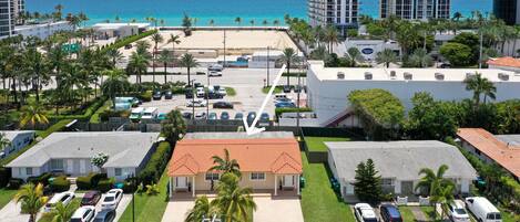 Cross the street, walk along the white building and your at the Beach!4 min walk