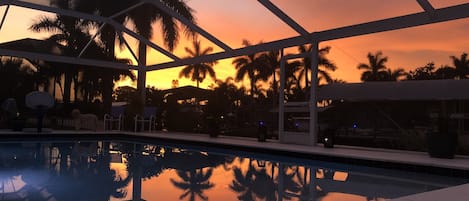 Sunset with reflection on the pool. We get incredible sunsets and sunrises.