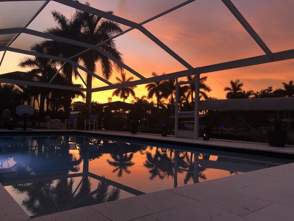 Sunset with reflection on the pool. We get incredible sunsets and sunrises.