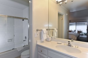 Vanity Area with tub and shower