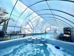 The heated pool and hot tub are enclosed for winter swimming.