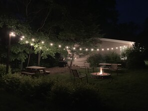Enjoy a campfire or BBQ under the string lights.
