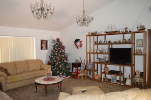 Living room showing off the the Military Tree.  Sofa makes into a queen size bed