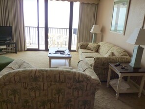 living room with balcony - both couches pull out into beds