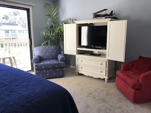 Sitting Area in Master Bedroom with a partial view of one balcony.
