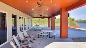 Patio w/shade, picnic tables, rocking chairs, grill and hammock.  A great view