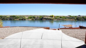 Walk leading to beach, fire pit, shade sails.  Foot wash is adjacent to path