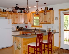 Open & airy kitchen. Dining for 6 is across the room.