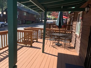 Front deck with table, umbrella and 4 chairs
