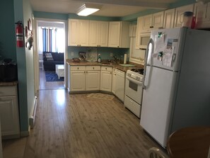 Spacious kitchen with beautiful Italian granite counter tops with dinette