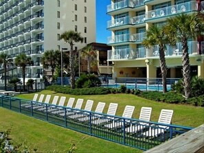 Relax on the grassy sundeck or take a dip in one of our pools and lazy river