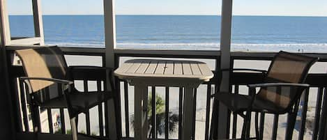 Oceanfront screened balcony located adjacent to living room.