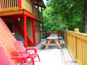 Lower level party deck. Perfect for large gatherings and quaint meals outside!