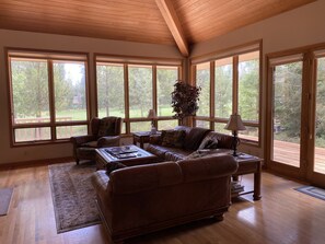 View of Woodlands golf course from the living room, access to wrap around deck.