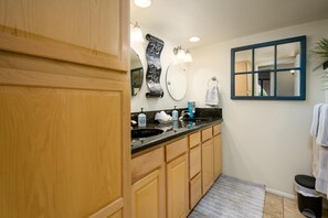Updated bathroom with raised vanity and granite counter tops